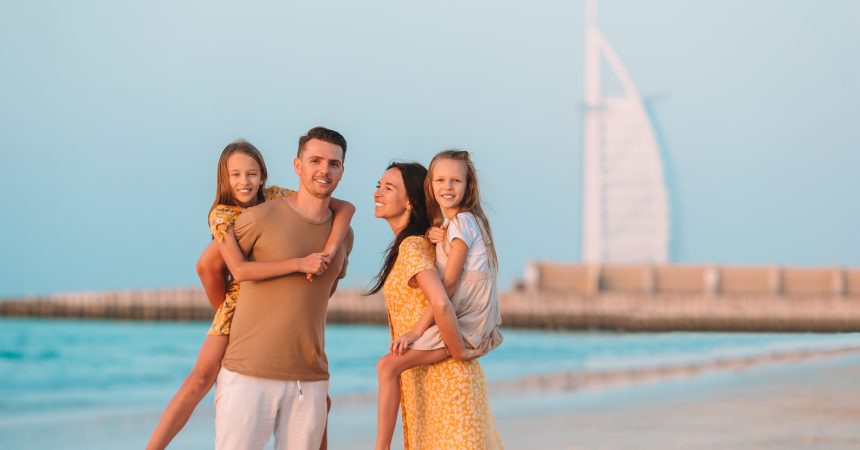 Happy family on the beach during summer vacation