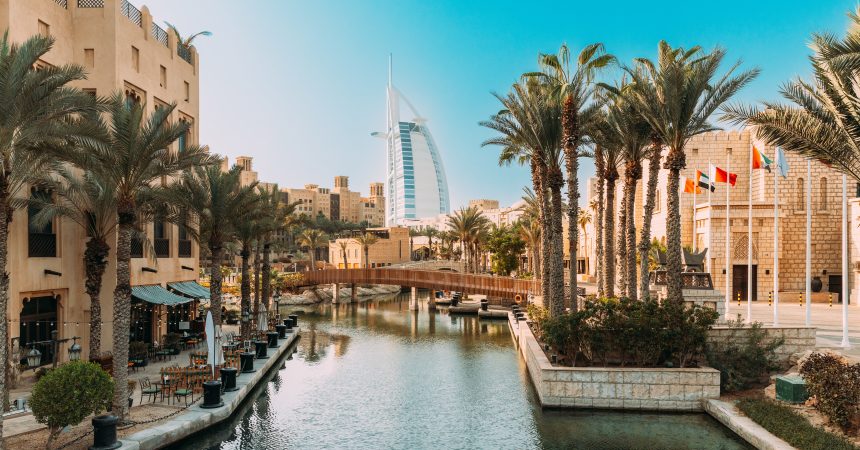 View of hotel Burj Al Arab from Madinat Jumeirah. Madinat Jumeirah the Arabian Resort - Dubai is a 5 star resort in Dubai. It is the largest resort in the Emirate